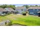 Large backyard with pond, screened porch, patio, and well-maintained lawn at 1302 Paint Horse Ct, Mount Pleasant, SC 29429