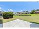 Backyard featuring a pond view, and mature landscaping in a neighborhood with well-maintained lawns at 1302 Paint Horse Ct, Mount Pleasant, SC 29429
