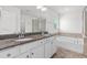 Ensuite bathroom featuring double sink, granite countertops, and soaking tub at 1302 Paint Horse Ct, Mount Pleasant, SC 29429