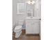 Bathroom featuring a toilet, vanity with sink, and mirror plus a partial view of the bathtub at 1302 Paint Horse Ct, Mount Pleasant, SC 29429