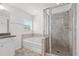 Bathroom featuring soaking tub and glass enclosed tiled shower at 1302 Paint Horse Ct, Mount Pleasant, SC 29429