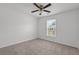 Carpeted bedroom with ceiling fan and window at 1302 Paint Horse Ct, Mount Pleasant, SC 29429