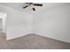 Bedroom featuring neutral carpeting, a ceiling fan, and access to another room at 1302 Paint Horse Ct, Mount Pleasant, SC 29429