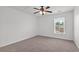 This bedroom has a ceiling fan and natural light from the window at 1302 Paint Horse Ct, Mount Pleasant, SC 29429
