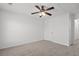 Carpeted bedroom features a ceiling fan and a single window at 1302 Paint Horse Ct, Mount Pleasant, SC 29429