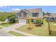 A corner lot home with a two-car garage, brick facade, and well-maintained lawn at 1302 Paint Horse Ct, Mount Pleasant, SC 29429
