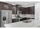 Modern kitchen with stainless steel appliances, granite counters, and mosaic backsplash at 1302 Paint Horse Ct, Mount Pleasant, SC 29429
