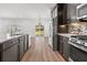 Contemporary kitchen with stainless steel appliances, modern cabinets and backyard view at 1302 Paint Horse Ct, Mount Pleasant, SC 29429