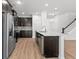 Well-lit kitchen showcasing stainless steel appliances, granite countertops, and dark wood cabinets at 1302 Paint Horse Ct, Mount Pleasant, SC 29429