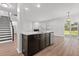 Kitchen island with breakfast bar and view of the living space with a fireplace at 1302 Paint Horse Ct, Mount Pleasant, SC 29429
