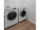 Close-up view of the GE washer and dryer in the laundry room at 1302 Paint Horse Ct, Mount Pleasant, SC 29429