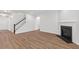 Open concept living space with a fireplace and a staircase leading to the upper level at 1302 Paint Horse Ct, Mount Pleasant, SC 29429