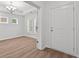 Bright room with wood floor, white walls, windows with shutters and a door at 1302 Paint Horse Ct, Mount Pleasant, SC 29429