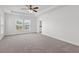 Large, bright main bedroom featuring neutral carpet and a double window at 1302 Paint Horse Ct, Mount Pleasant, SC 29429