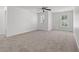 Large main bedroom with two windows, a ceiling fan and neutral carpet at 1302 Paint Horse Ct, Mount Pleasant, SC 29429
