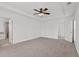 Large main bedroom with neutral carpet and access to ensuite bathroom at 1302 Paint Horse Ct, Mount Pleasant, SC 29429