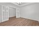 Bright office space featuring tray ceilings, wood floors, and glass French doors at 1302 Paint Horse Ct, Mount Pleasant, SC 29429