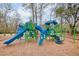 A vibrant community playground with slides, climbing structures, and a soft, mulched play area at 1302 Paint Horse Ct, Mount Pleasant, SC 29429