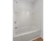 Bathroom featuring a shower and tub combination with chrome fixtures and white tile surround at 1302 Paint Horse Ct, Mount Pleasant, SC 29429