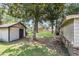 Private backyard with mature trees and outbuilding at 131 Wedgewood Cir, Goose Creek, SC 29445