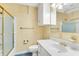 This bathroom has a shower with glass doors, a large vanity, and unique wallpaper at 131 Wedgewood Cir, Goose Creek, SC 29445