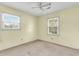 The bedroom offers natural light with two windows and neutral colored walls at 131 Wedgewood Cir, Goose Creek, SC 29445