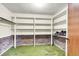 Walk-in closet with built-in shelving and brick accents at the base at 131 Wedgewood Cir, Goose Creek, SC 29445