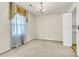 A charming dining room with a chandelier and a window with elegant draperies at 131 Wedgewood Cir, Goose Creek, SC 29445
