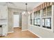 Cozy dining area features wainscoting, large windows, and chandelier lighting at 131 Wedgewood Cir, Goose Creek, SC 29445