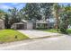 Exterior view featuring an expansive driveway and attached carport at 131 Wedgewood Cir, Goose Creek, SC 29445