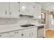 A well-lit kitchen features ample counter space, a stainless steel sink, and tiled backsplash at 131 Wedgewood Cir, Goose Creek, SC 29445