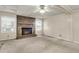 Neutral living room features a brick fireplace, a ceiling fan and natural lighting at 131 Wedgewood Cir, Goose Creek, SC 29445