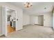 An open living room offers kitchen access, hardwood flooring, and a decorative chandelier at 131 Wedgewood Cir, Goose Creek, SC 29445
