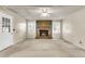 Charming living room with a brick fireplace, natural light, and neutral paint at 131 Wedgewood Cir, Goose Creek, SC 29445