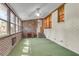 A sunroom with brick walls, carpet, and windows provides lots of natural light at 131 Wedgewood Cir, Goose Creek, SC 29445