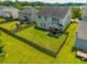 Aerial view of a home with a fenced yard, covered patio, and mature landscaping at 135 Gaslight Blvd, Summerville, SC 29483