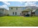 Large backyard with covered patio, ideal for entertaining or Gathering gatherings at 135 Gaslight Blvd, Summerville, SC 29483