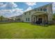 Well-maintained backyard with lush lawn, wood fence, and covered patio perfect for outdoor living at 135 Gaslight Blvd, Summerville, SC 29483