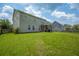 Spacious backyard with a covered patio offers a great space for outdoor enjoyment and activities at 135 Gaslight Blvd, Summerville, SC 29483