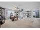 Large bonus room features a ceiling fan, office desk, decorative shelving, and neutral carpeting at 135 Gaslight Blvd, Summerville, SC 29483