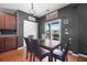 Inviting dining area featuring a dark wood table, seating for four, and sliding glass doors to the backyard at 135 Gaslight Blvd, Summerville, SC 29483