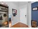 Welcoming foyer with wood floors, a decorative mirror, and a convenient storage cubby for shoes and accessories at 135 Gaslight Blvd, Summerville, SC 29483