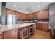 Well-equipped kitchen featuring stainless steel appliances, granite countertops, an island, and hardwood floors at 135 Gaslight Blvd, Summerville, SC 29483