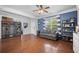 Bright and inviting living room featuring hardwood floors, wood-paneling, and a mudroom storage with seating at 135 Gaslight Blvd, Summerville, SC 29483