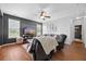 Comfortable living room with a ceiling fan, large TV, hardwood floors, and a cozy recliner for relaxation at 135 Gaslight Blvd, Summerville, SC 29483