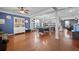 Spacious living room with hardwood floors, pool table, and plenty of natural light at 135 Gaslight Blvd, Summerville, SC 29483