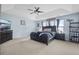 Spacious main bedroom featuring neutral carpet, ceiling fan, and ensuite bathroom at 135 Gaslight Blvd, Summerville, SC 29483
