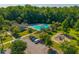 A sparkling community pool, nestled amidst lush greenery, offers a refreshing escape with lounge chairs and a playground at 135 Gaslight Blvd, Summerville, SC 29483