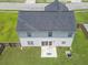 Aerial view of a home with a large backyard, patio, and well-maintained lawn at 1350 Pinyon Pine Dr, Ladson, SC 29456