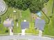 Aerial view of a well-maintained neighborhood with homes featuring green lawns and mature trees at 1350 Pinyon Pine Dr, Ladson, SC 29456